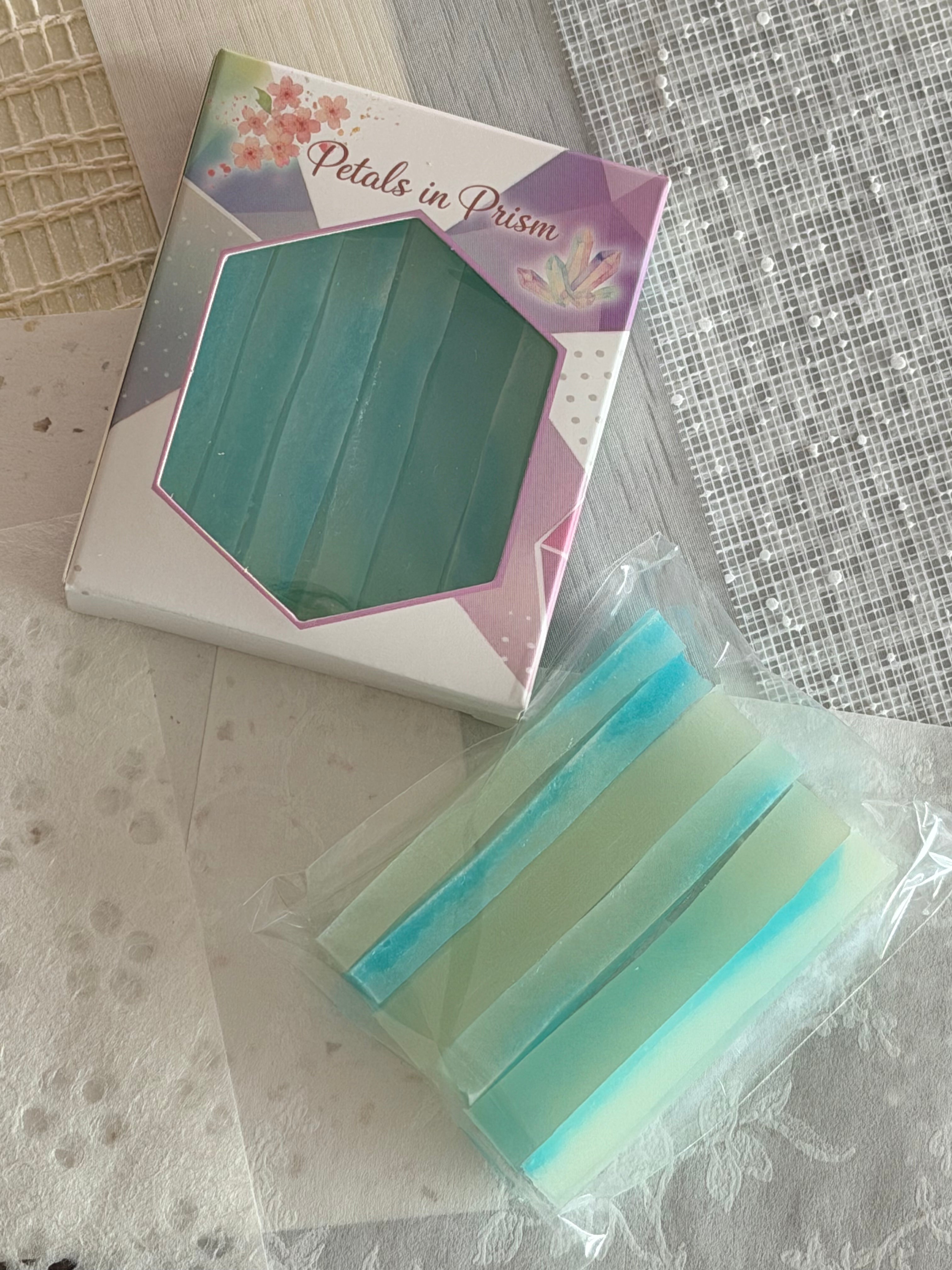 Crystal candy prisms beside a Petals in Prism gift box